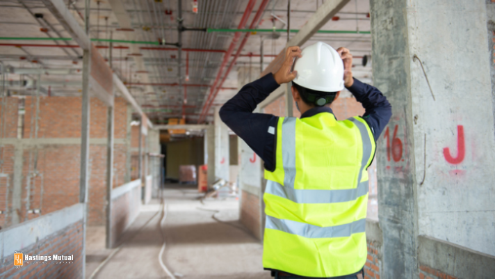 construction worker with hands on head