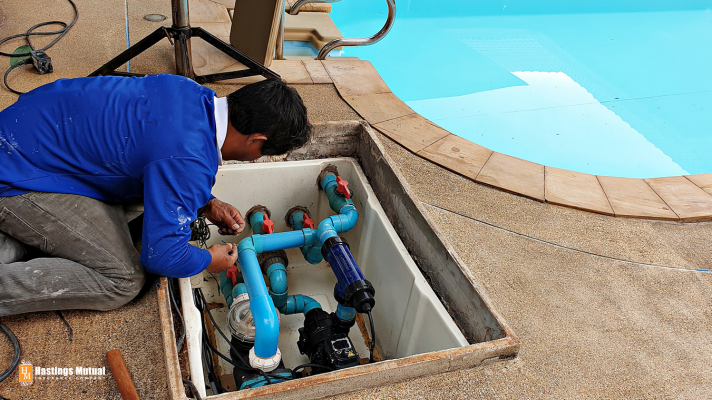 man fixing pool pump