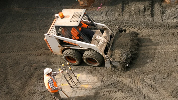 a small earth mover on a construction site