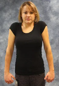 person demonstrating the circular arm stretch described below