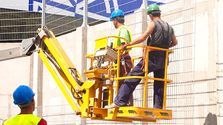 construction workers on an aerial platform