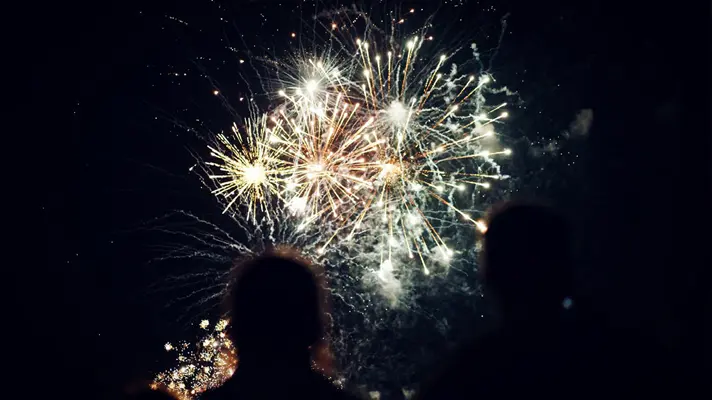 two people watching fireworks