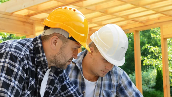 two contractors wearing hard hats