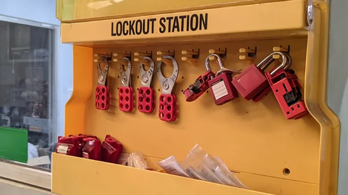 a lockout station in a commercial facility with locks hanging in it