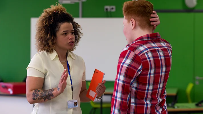 teacher and student having intense conversation
