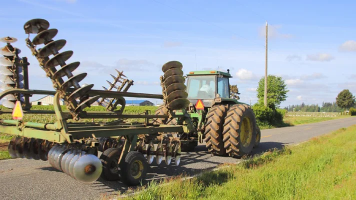 tractor driving on a road