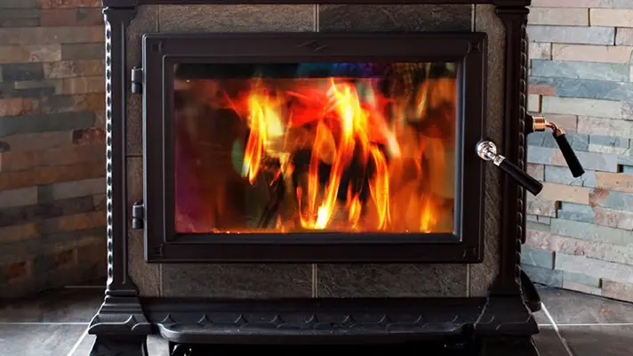 wood stove with a blazing fire